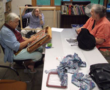 Dolores, Diane, Susan discuss weaving.