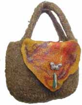 felted brown bag with gold flap with butterfly closure