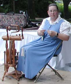 Connie Creed spins at Austin Science Fun Day stage demonstration.