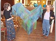 Eileen and Carol display the shawl